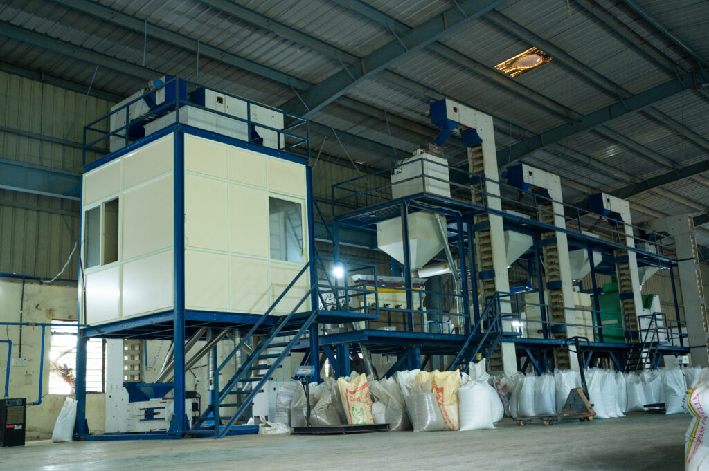 Quessentials processing line at the Malur facility — multi-stage cleaning and grading equipment