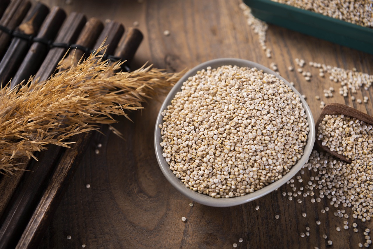 White quinoa seeds in a bowl — Chenopodium quinoa, ready-to-cook grade